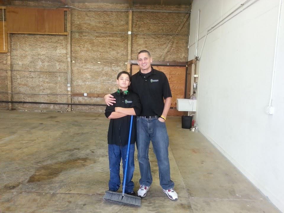 Jason Sayre and his son Julian in Platinum's first warehouse space