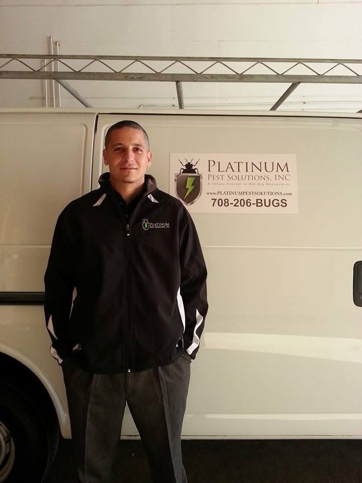 Jason Sayre, Platinum's founder and CEO, standing next to the company's first van and logo